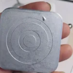 Surface blistering defect on a zinc die casting after plating