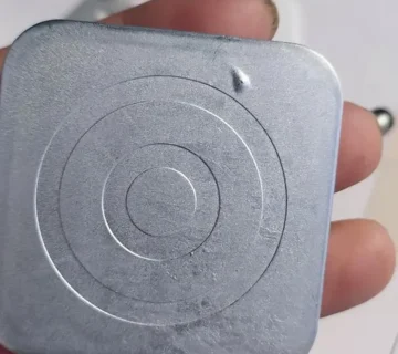 Surface blistering defect on a zinc die casting after plating